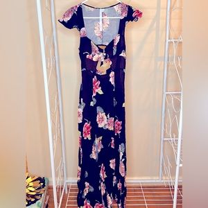 Navy Blue Floral Dress with back and chest cutouts. Perfect for a beach getaway.